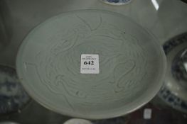 Chinese celadon glazed circular dish incised with fish.