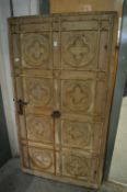 A large old decorative pine door.