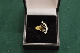 A silver dress ring.