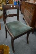 A set of four 19th century mahogany dining chairs (faults).