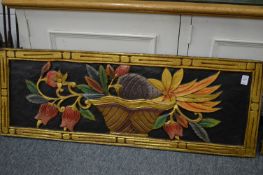 A pair of decorative carved wood panels depicting flowers and fruit in bowls.