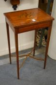 An Edwardian marquetry inlaid satin wood occasional table.