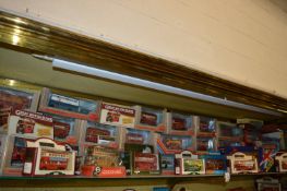 A quantity of Corgi and other boxed model buses.