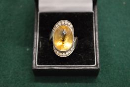 A silver dress ring.