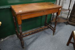 A Victorian walnut writing desk, the rising top opening to reveal a fitted interior.