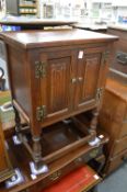 A small oak two door cabinet.
