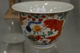 A Chinese polychrome decorated circular bowl painted with fish.