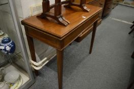 A 19th century mahogany rectangular fold-over tea table.