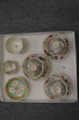 A set of three Japanese eggshell porcelain bowls, stands and covers and three other items.