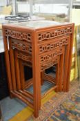 A nest of four Chinese tables.