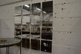 An unusual sixteen section modernist wall mirror.