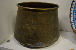 An Eastern engraved brass jardiniere.