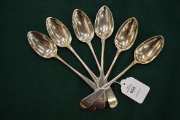 A set of six silver dessert spoons.