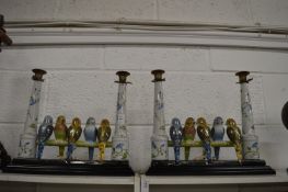 A pair of unusual and amusing candelabra formed as budgies on a perch.