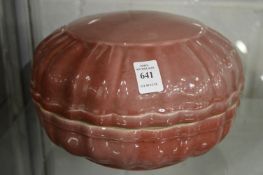 A large Chinese Sang de boeuf bowl and cover.