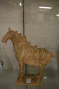 A Chinese Tang style horse with agate style glazing.