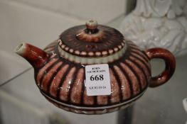 A Chinese sang de boeuf glazed teapot and cover.