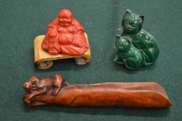 A cinnabar lacquer miniature Buddha on stand, a malachite cat group and a carved wood apple corer.