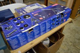 A boxed astronomical telescope.