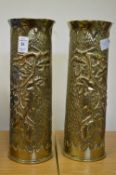 Trench Art, a pair of hammered brass shell cases formed as vases.