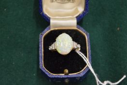 A good 18ct yellow gold diamond and opal ring.
