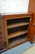 A Victorian walnut open bookcase.
