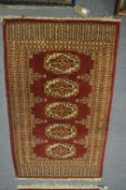 A Bokhara style rug, 130cm x 77cm.