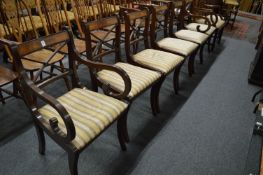 A set of six Regency style mahogany dining chairs, two with arms.