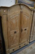 A 19th century French pine armoire.