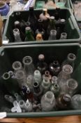 A quantity of early glass bottles, jars etc.