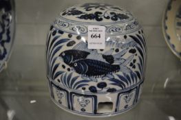 A Chinese blue and white dome shaped water jar.