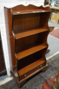 A mahogany waterfall style bookcase.