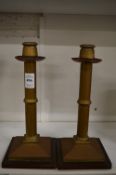 A pair of Arts and Crafts copper and brass candlesticks.