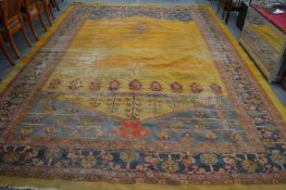 A large Afghan carpet (some wear and holes) 480cm x 330cm.