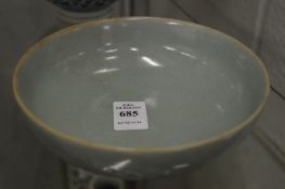 Chinese celadon glazed circular bowl with moulded lotus leaf decoration.