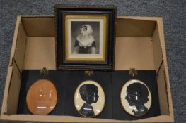 A pair of portrait miniature silhouettes and two other items.