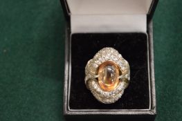 A silver dress ring.