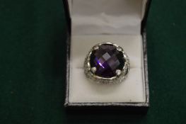 A silver dress ring.