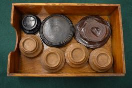 A group of turned wood stands.