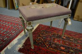 A French style upholstered foot stool.