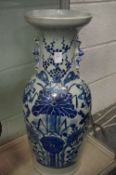 A large Chinese blue and white vase (restored).
