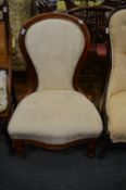 A Victorian mahogany framed bedroom chair.