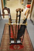 A stick stand and contents.