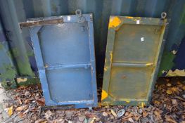 Two tailgates, possibly from an early Land Rover or Willys Jeep.