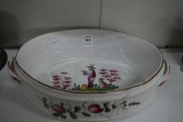 A French oval tin glazed twin handled dish, possibly Luneville, decorated with Chinese fisherman and