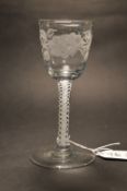 A good George III wine glass with opaque double twist stem, the bowl engraved with flowers.