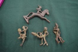 A group of bronze erotic figures.