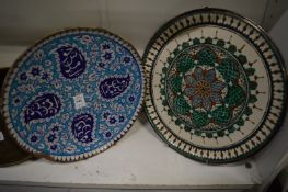 Two Islamic pottery plates.