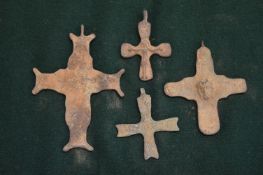 A small group of bronze crosses.