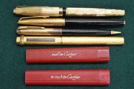 A group of pens and accessories.